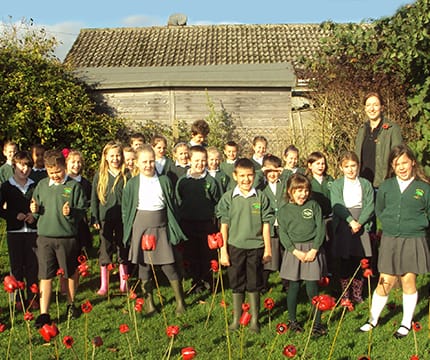 Spectra help local school create remembrance field of poppies